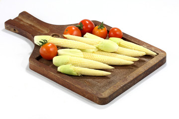 Baby corns on wood plate