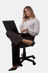 Woman on the phone holding laptop