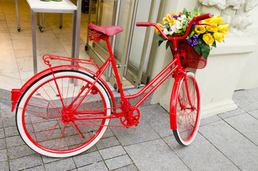 Fototapeta na wymiar vintage red bicycle in the street