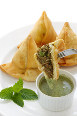 keema samosa with fresh mint dipping sauce , indian food