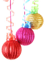 Christmas balls hanging with ribbons isolated on white