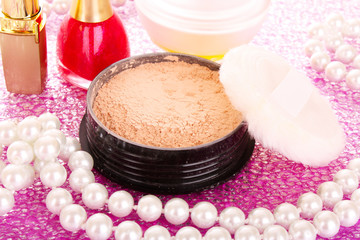 Obraz na płótnie Canvas makeup powder on pink background