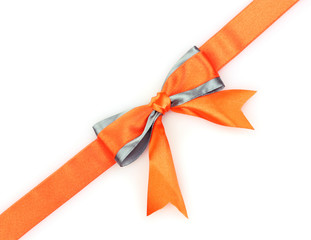 Orange  ribbon and bow isolated on white background