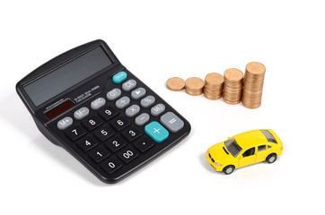 Calculator,coins and toy car