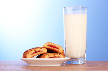cookies with milk on blue background