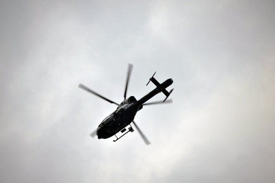 Police helicopter hovering over EDL demonstration