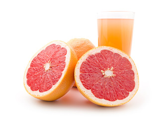 Ripe grapefruit and a glass of juice