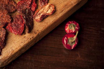sun-dried tomatoes on wood cutting board