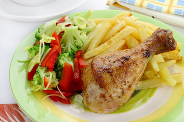 Fried chicken leg with french fries