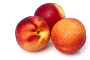 Fototapeta na wymiar Juicy peaches isolated on white background