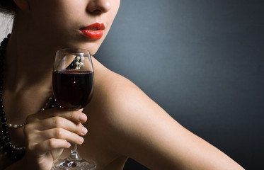 beautiful woman with glass red wine