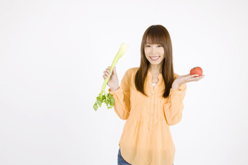 野菜を持った女性