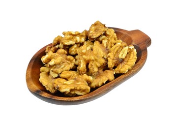 Walnuts on an oval wooden plate on white background
