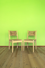 Two wooden chairs in a room