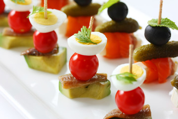 canapes on toothpicks , appetizer, pinchos , spanish food
