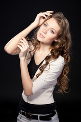 Fototapeta premium Portrait of beautiful female on black background