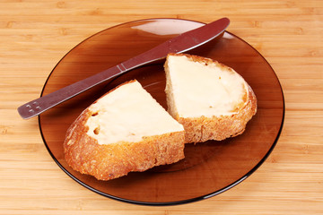 slices of buttered bread on a plate