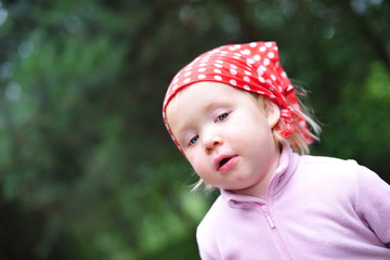 a girl in red bandana