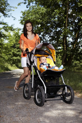 Fototapeta na wymiar Walking with baby coach