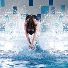 Swimmer jumping in swimming pool