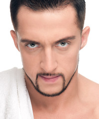 Obraz premium Young man with white towel. SPA. Isolated.