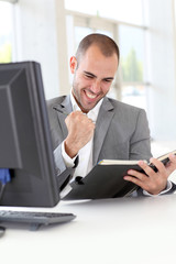 Closeup on successful businessman in office