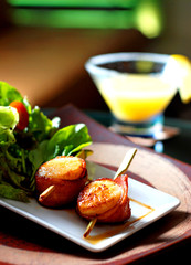 A single sea scallop in shell, grilled to perfection marinated w