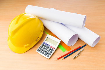 Drawings and hard hat on the desk