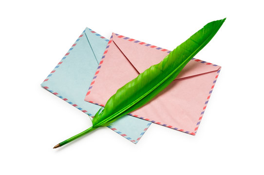 Envelope and feather isolated on the white