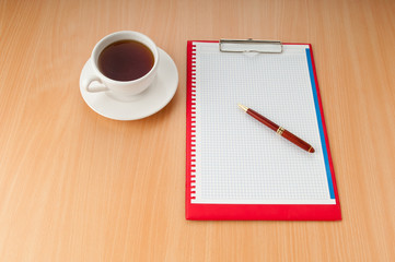 Binder with blank page and tea