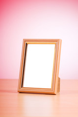 Wooden picture frames on the gradient background