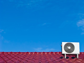 air conditioner compressor on the red roof