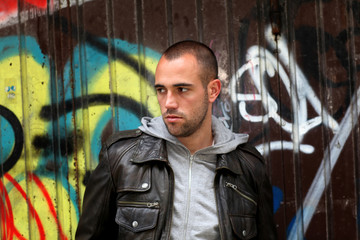 Portrait of bad boy in suburb street