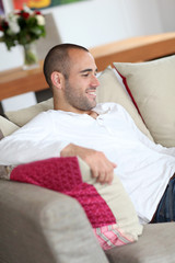 Portrait of handsome man relaxing at home