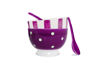 Purple bowls and spoons on white background