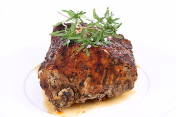 Roast pork decorated with savory blooming twigs