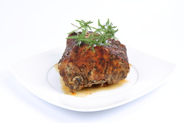 Roast pork decorated with savory blooming twigs