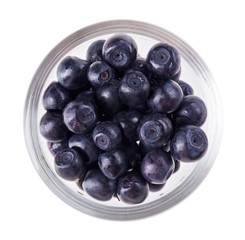 Bilberry fruit in transparent glass, isolated on white macro