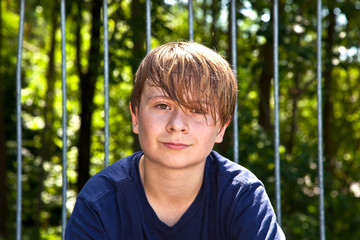 young happy boy sweating and exhausted from sports