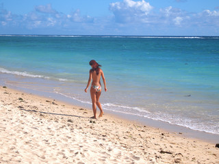 Sexy, semi naked woman at the beach