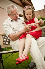 Happy retirement - grandparent with grandchild