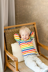 toddler lying in the chair