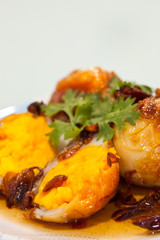 Fried eggs topped with sweet sauce