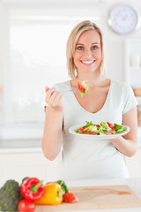 Woman eating salad