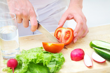 Hands  cooking vegetables salad