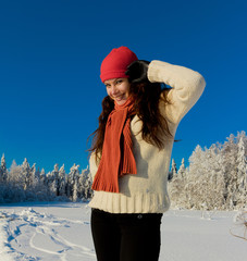 Fototapeta na wymiar Young Woman Enjoying the Snow