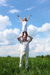 father with daughter in summer day outdoors