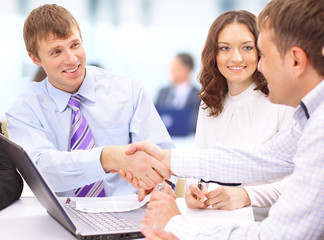 Fototapeta premium Business people shaking hands, finishing up a meeting