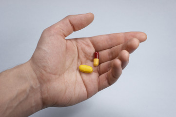 Hand with two pills