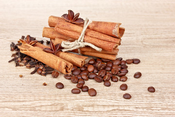 cinnamon and coffee on wooden background